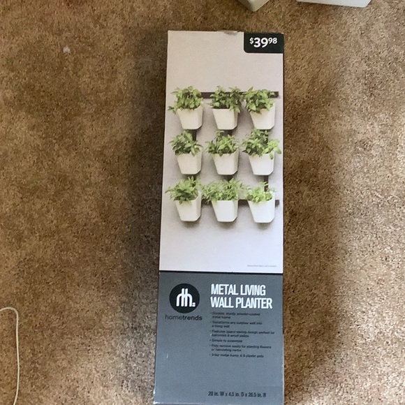 I’m selling a browny black plant shelf. - Picture 7 of 8